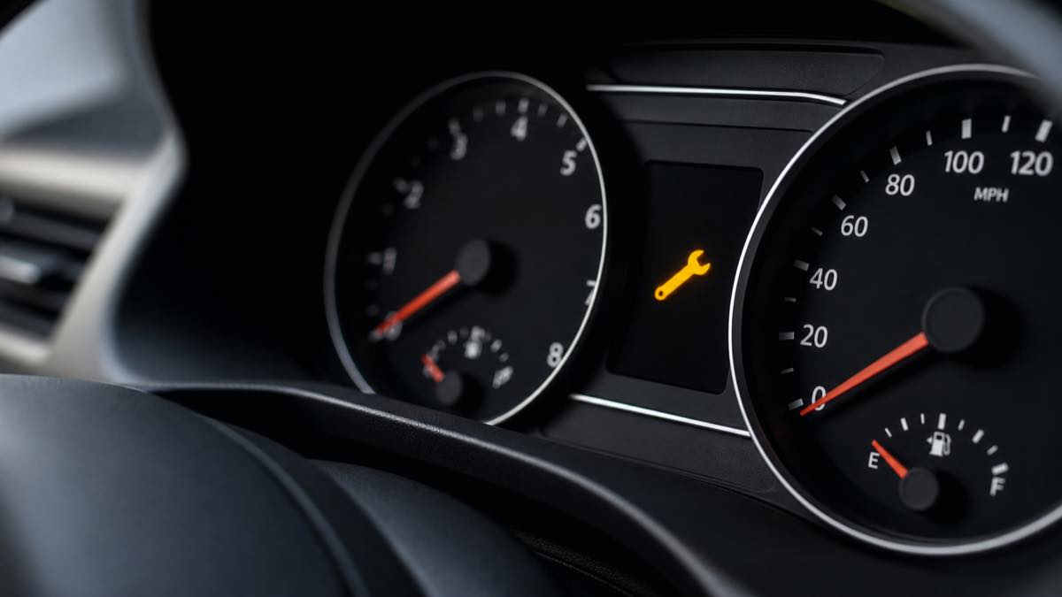 Wrench warning light illuminated on car dashboard